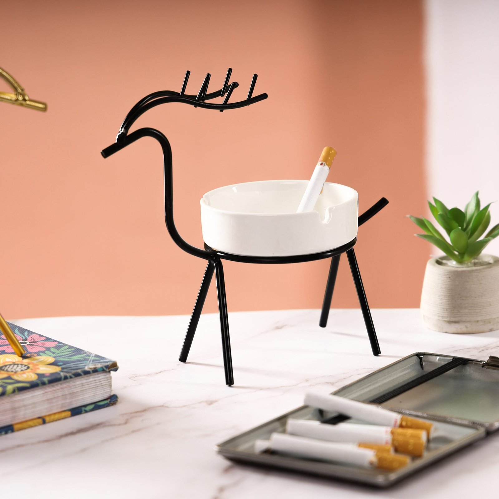 Product photography of a deer-shaped cigarette ashtray