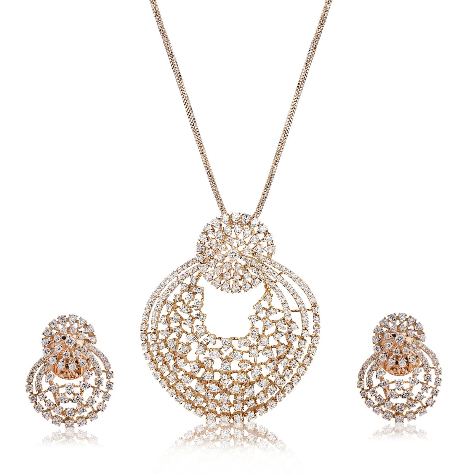 Jewelry photography of a gold diamond necklace set on a white background.