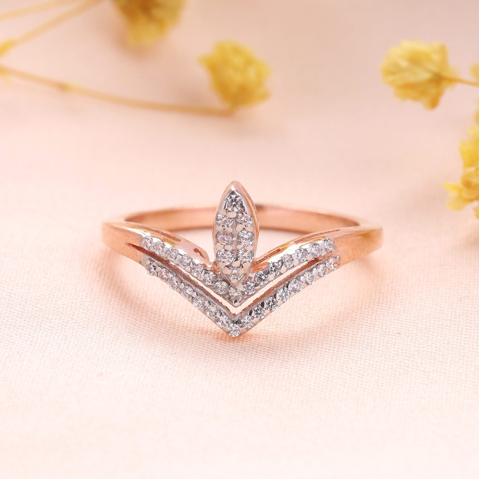 Elegant jewelry photography of a rose gold ring with multiple white stones in Jaipur, showcasing intricate craftsmanship