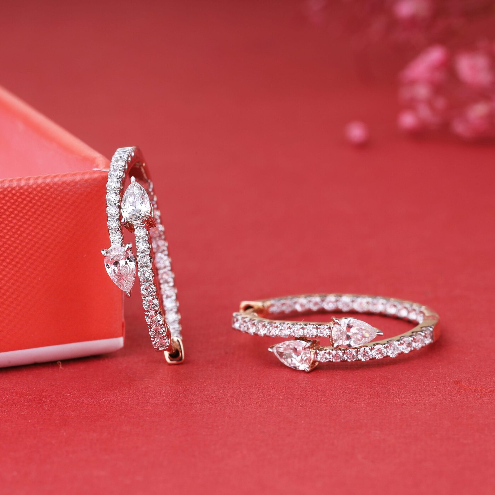 Close-up e-commerce jewelry photography of a gold earring with multiple white stones in Jaipur, showcasing its intricate design