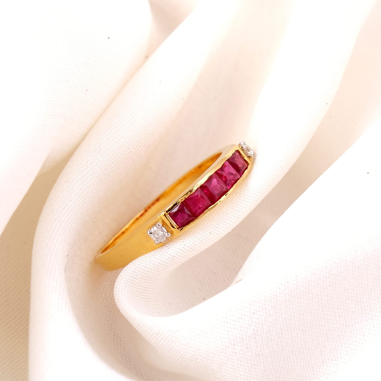 Side view jewelry photography of a gold ring with pink topaz in Jaipur, highlighting the gemstone’s clarity