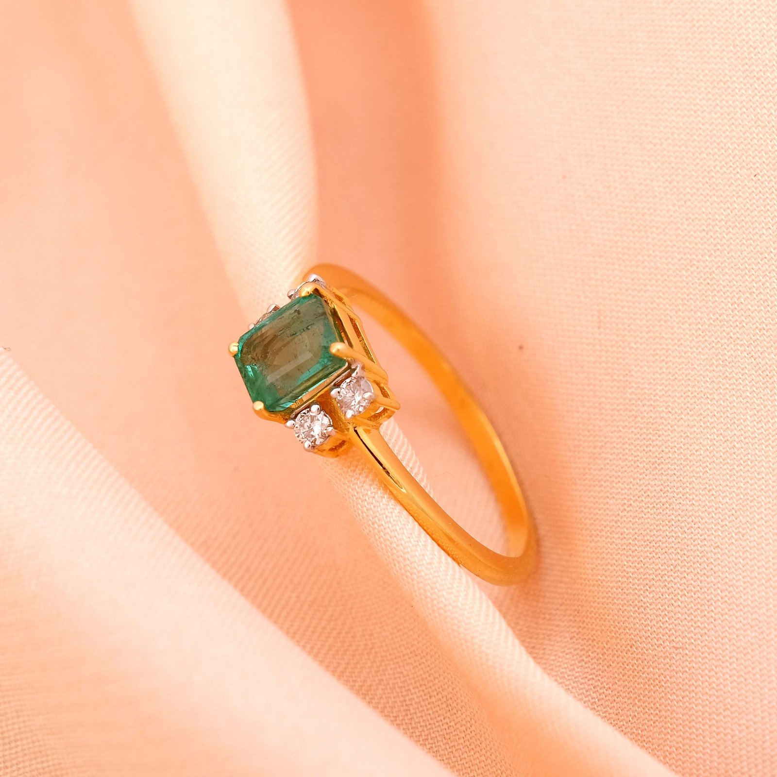 Creative e-commerce jewelry photography of a gold ring with multiple stones in Jaipur, captured against a dark background