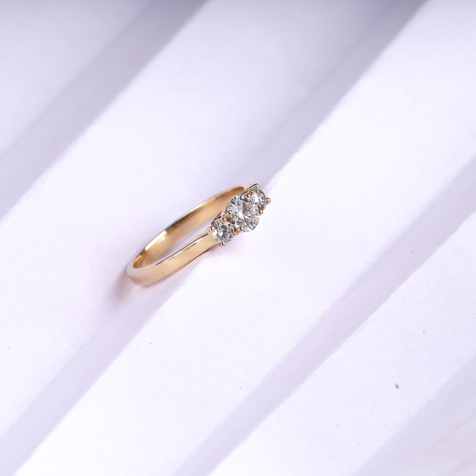 Side view jewellery photography of a gold ring with multiple white stones in Jaipur, highlighting the clarity of the stones