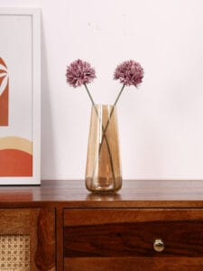 Stylish modern vase with dried flowers on wooden table, photographed with natural light by Emipix Solutions in Jaipur